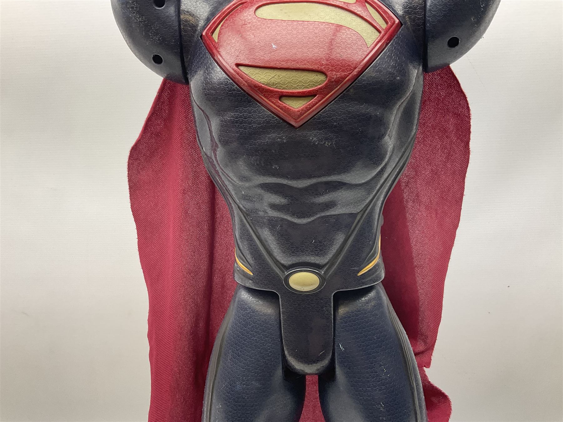 Composite Superman with cape, together with a composite female statue holding the American flag, tallest example H103cm