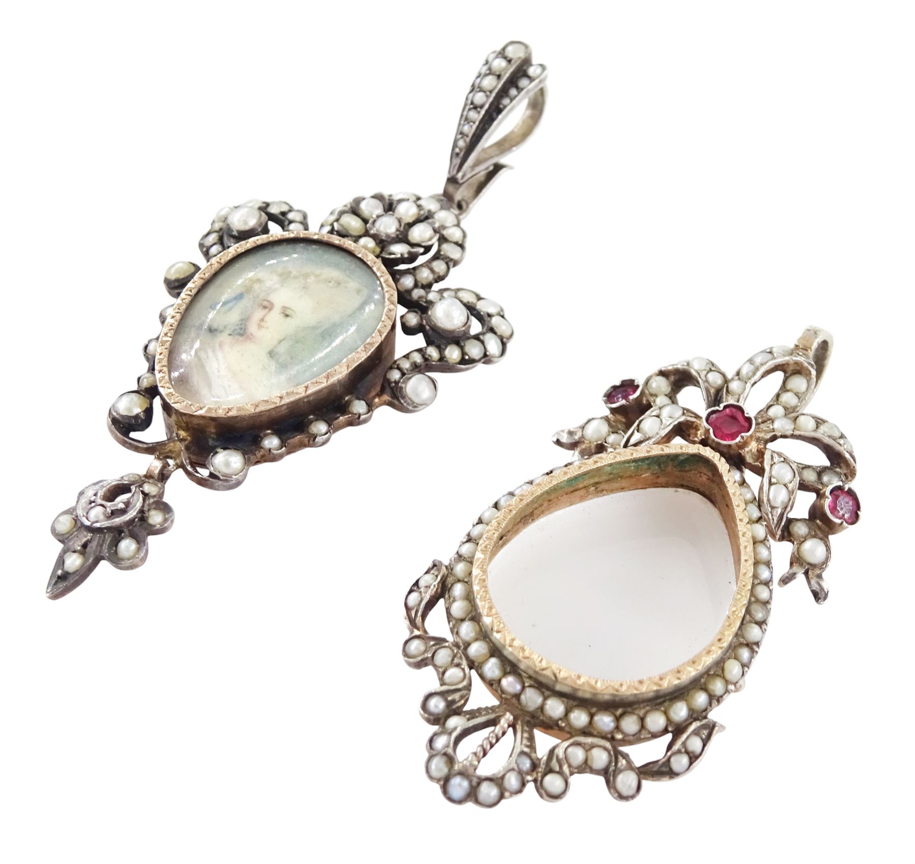Two 19th century French silver pearl locket pendants, the first set with a pear shaped portrait miniature of a woman in 18th century dress on ivory, within a milled bezel and openwork split and seed pearl surround, the other of similar design with ribbon surmount and set with garnets and seed pearls, both hallmarked. This lot has been registered for sale under Section 10 of the APHA Ivory Act