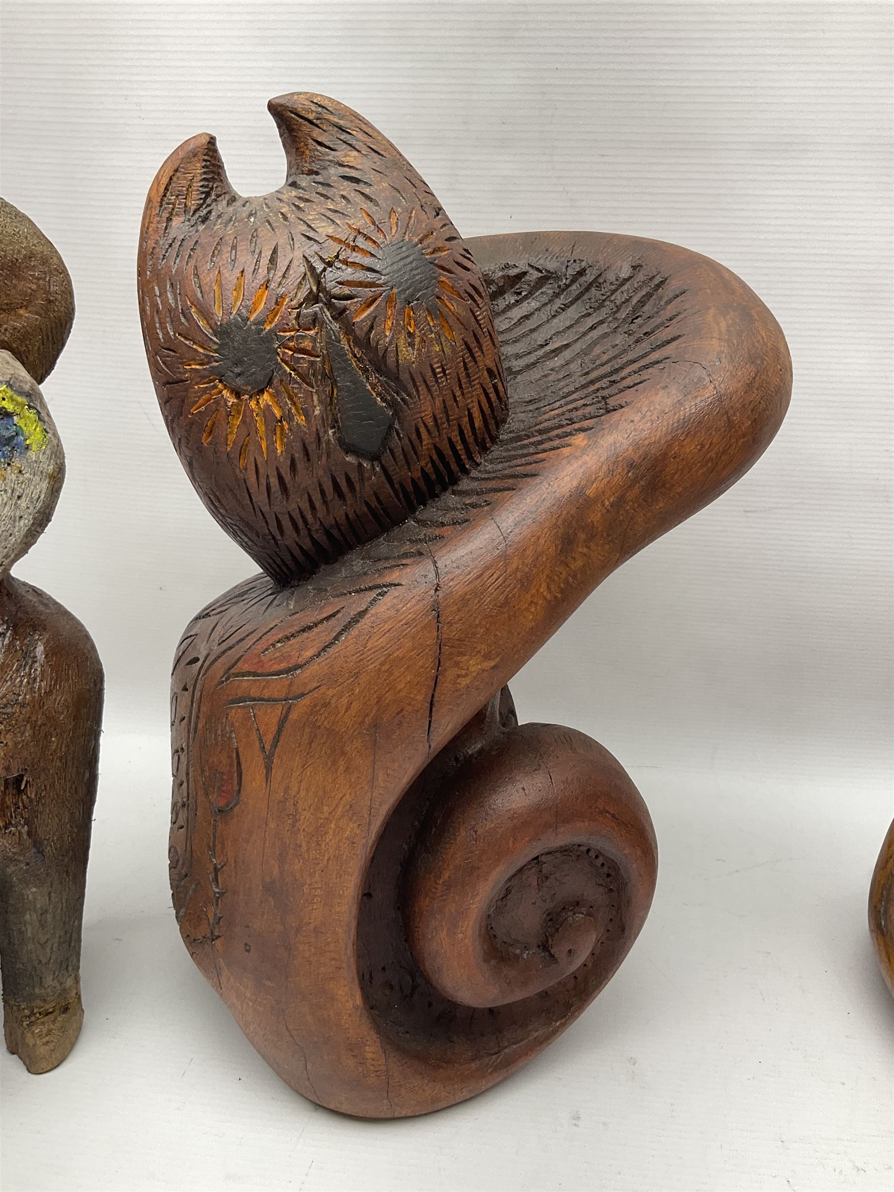Helen Skelton (British 1933 – 2023): Three carved wooden abstract sculptures, each modelled as a cat, with carved or painted features, largest H63cm. Born into an RAF family in 1933 in Kent and travelled the world extensively during her childhood. After settling in Bridlington, Helen immersed herself in painting, textiles, and wood sculpture, often inspired by nature's beauty. Her talent was showcased in a one-woman show at Sewerby Hall and recognised with the sculpture prize at Ferens Art Gallery in 2000. Sadly, Helen’s daughter passed away from cancer in 2005. This loss inspired Helen to donate her sculptures to Marie Curie upon her passing in 2023.