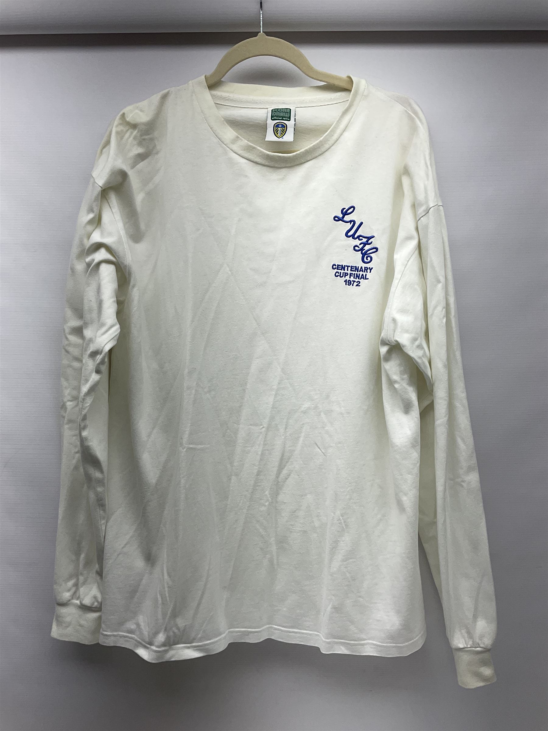 Fourteen items of replica sporting clothing including Leeds United football club shirts, England jerseys etc