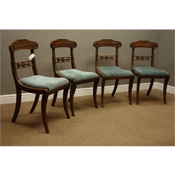  Set four Regency mahogany dining chairs, scrolled cresting rail carved with flower heads, rope twist uprights, carved middles rail, upholstered drop in seat, on moulded sabre legs  