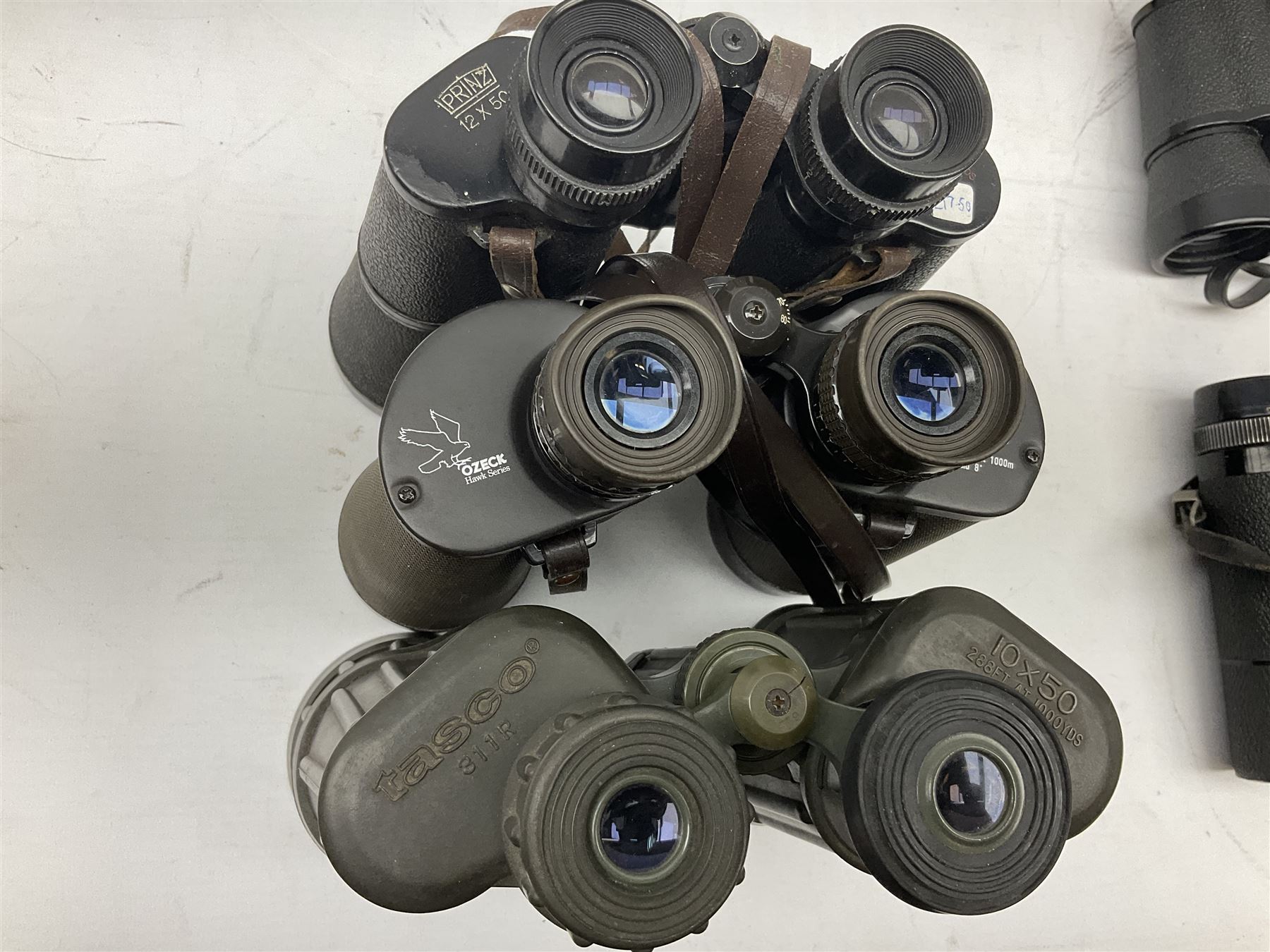 Eleven pairs of binoculars to include Lieberman & Gortz 20x65, Stem (USSR) 7x50, Helios 10x50 Field, Prinz 12x50, Tasco 8x40, Tasco 10x50, etc