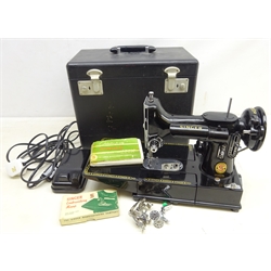  1950s/ 60's Singer Featherweight portable electric Sewing machine Model No.222K, with accessories booklet and foot pedal, in original black case  