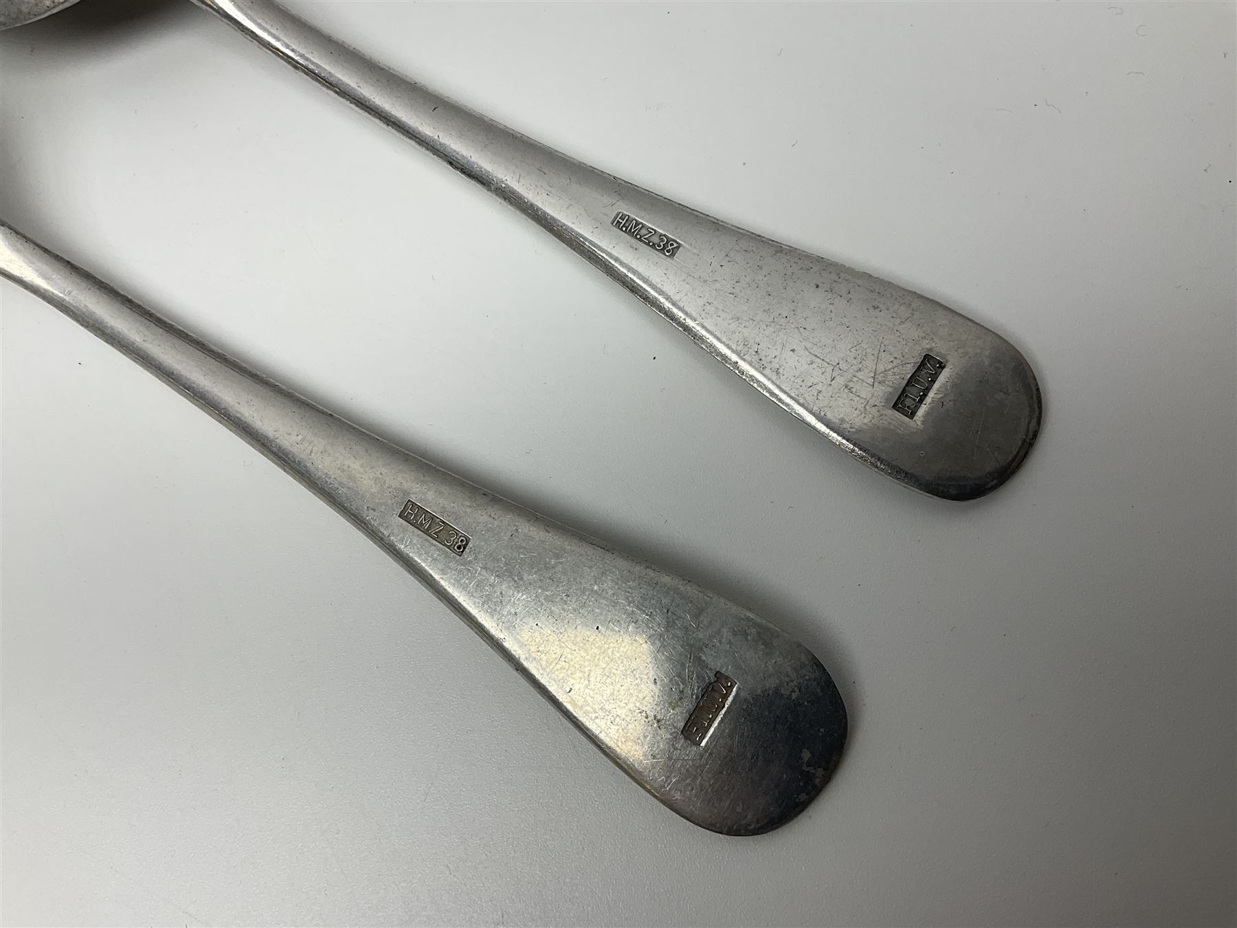 WW2 German Luftwaffe Mess cutlery comprising table spoon and fork, each with H.M.Z.38 mark; WW1 British War Medal awarded to L-13858 Gnr. J. McCabe R.A.; and small quantity of military badges, rank pips etc