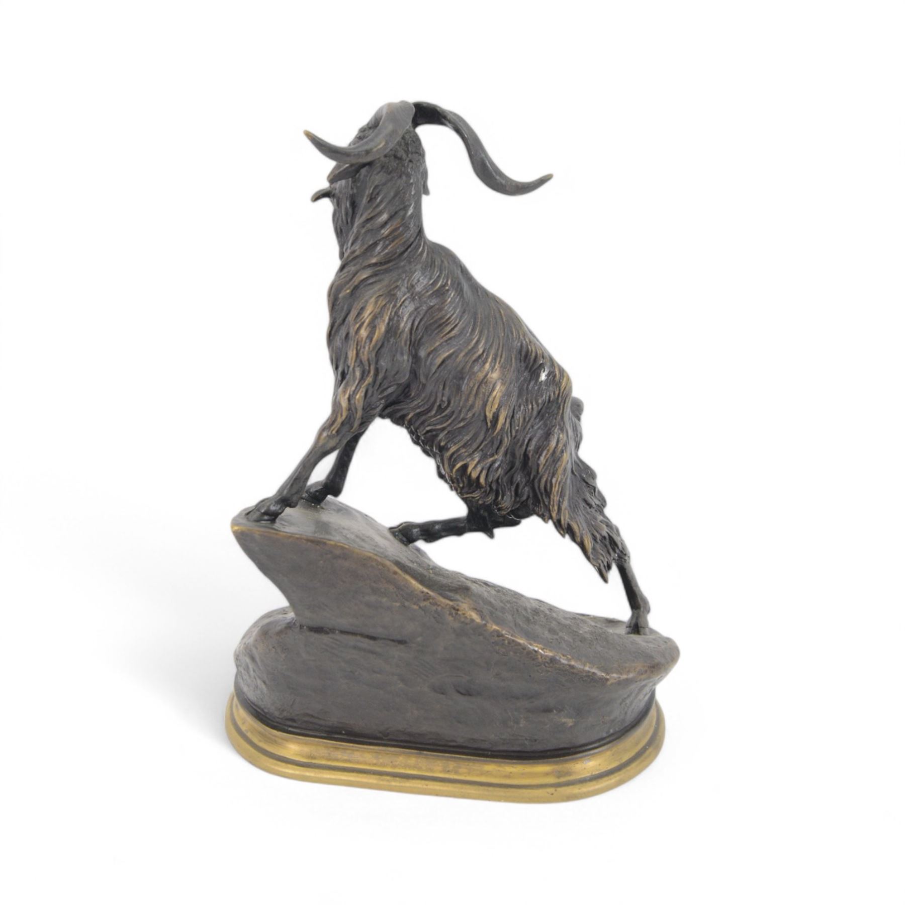 After Jules Moigniez, bronze figure of a goat climbing a rock, on oval plinth, inscribed signature, H28cm