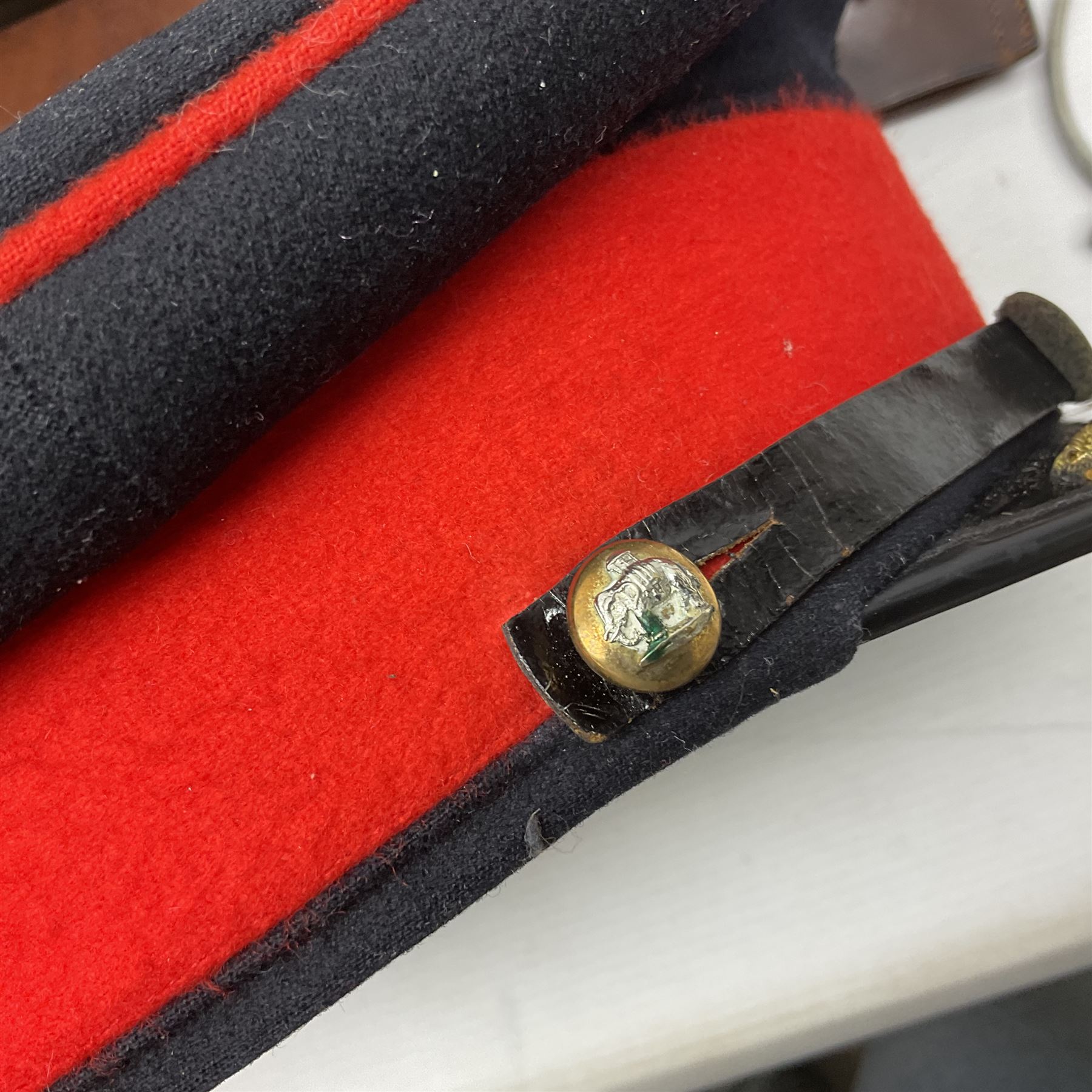 British Army General Staff officer's peaked cap by Herbert Johnson London in Moss Bros. delivery box; two officer's Sam Browne leather belts; leather pistol holster and sword hanger; pair of leather gloves and pair of spurs