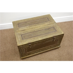  Middle Eastern brass covered hardwood box with hinged half lid, decorated in relief with scrolled leafage and foliage, angular carry handles and bracket feet, W61cm, H35cm, D45cm  