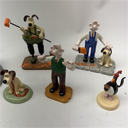 A group of six Coalport Wallace & Gromit figurines, comprising 'Hold on Gromit' no880/2000 with certificate, 'Decorating in Techno Trousers' no1195/2000 with certificate, 'Reading for Take Off', 'Do something Gromit', 'Feathers in disguise', 'Happy Birthday Gromit', each in maker's box with accompanying swing tag.