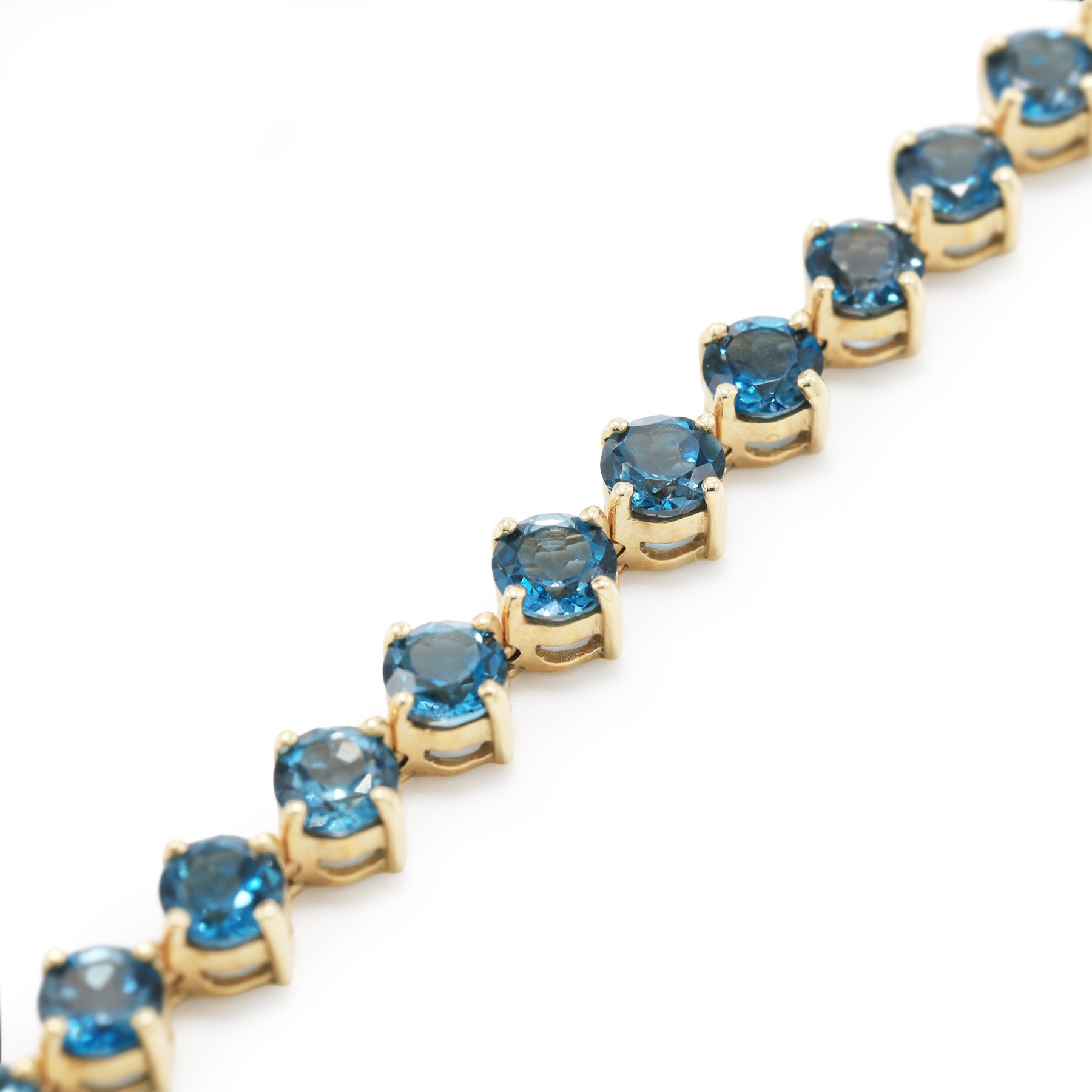 9ct gold London blue topaz bracelet, set with twenty-seven round cut topaz's, Birmingham 2006