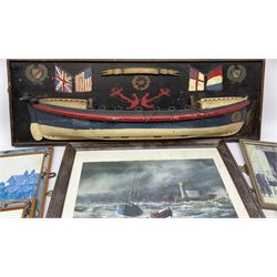 RNLI collection box in the form of a boat makers half block model, painted in the colours of a lifeboat with flag and ship motifs, H25cm, L73cm together with framed photos, postcards and prints of lifeboats and crew, including Scarborough lifeboat station