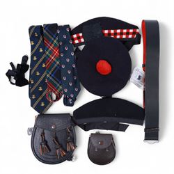 Piping regalia, comprising Armstrong tartan kilt with two kilt pins, three sporrans, including fur example, two jackets, Glengarry hat, other hats, collection of shirts, socks, ties, Hecsan shoes, dirk and belt