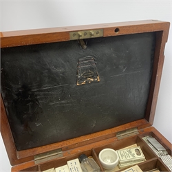  Dentistry - Late Victorian mahogany Dentists cabinet by C. Ash & Co, hinged cover above six long graduated drawers, enclosing a comprehensive arrangement of implements, pharmaceutical bottles, tools, modelling wax, porcelain teeth, 
