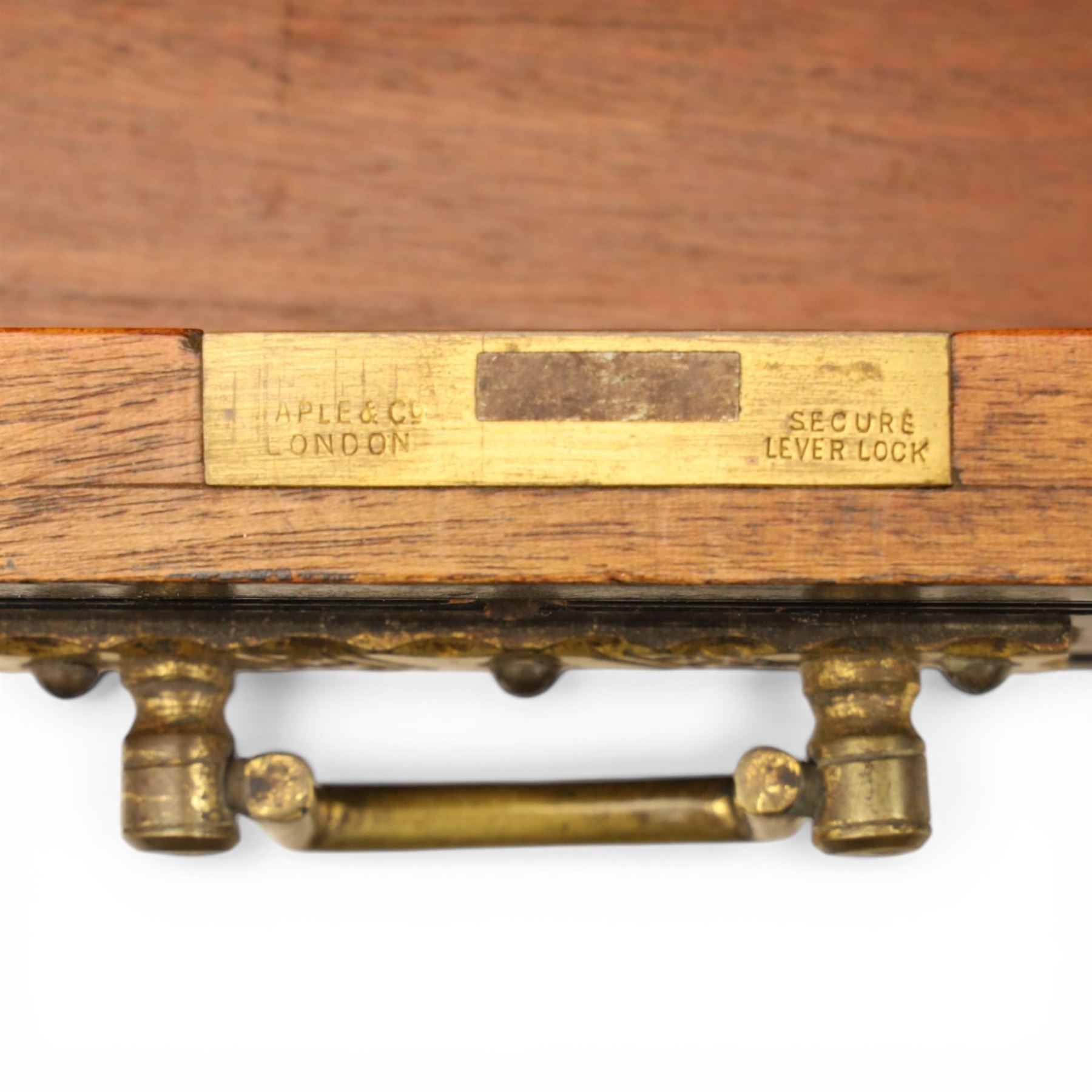 Victorian Aesthetic Movement ebonised writing desk, rectangular top with inset tooled leather, central frieze drawer with pierced spandrels, flanked by two banks of three drawers, brass swing handles, raised on turned supports 