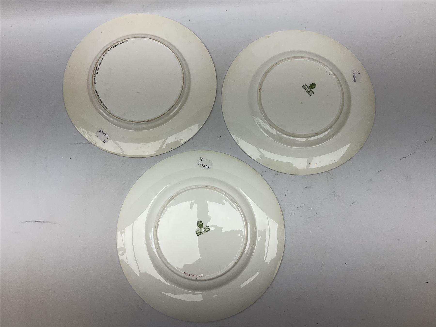 Four Frank Reynolds figures of ladies together with five plates painted by the same artist