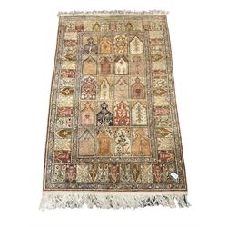Turkish Keyseri beige ground rug, decorated with multiple panels each with plant motifs and stepped arch pediments, flower head band border 