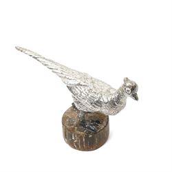 Silver model of a bird perched on a branch and with wooden base by Goldsmiths and Silversmiths Co. H5cm, small silver model of a pheasant on wooden base H2.5cm and a silver miniature model of a dog in a basket marked 925 and indistinct maker's mark L3.5cm (3)