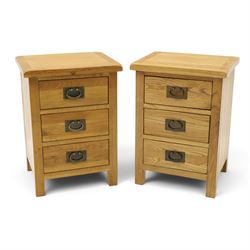 Pair of solid light oak bedside chests, rectangular top over three graduating drawers with...