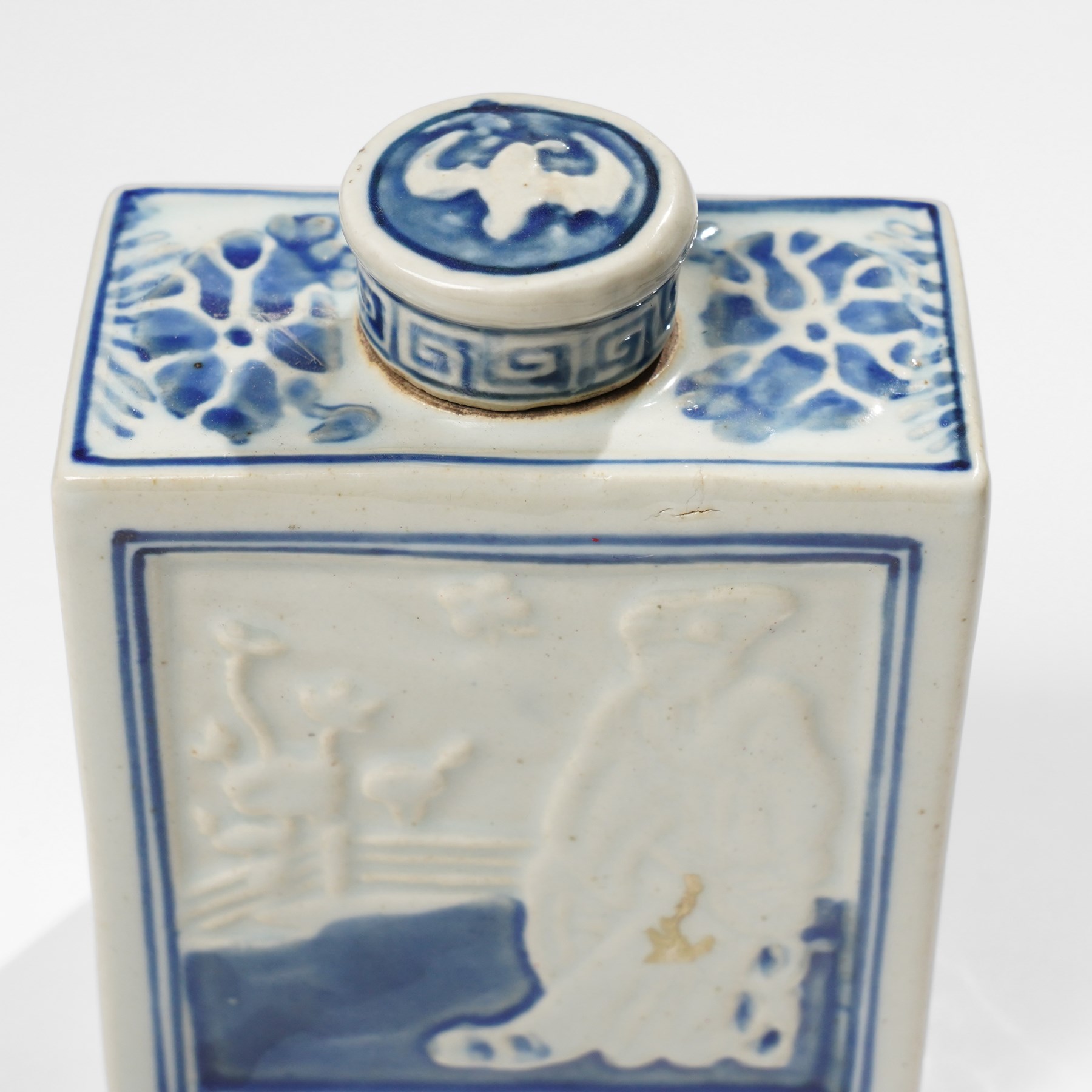 Two Chinese blue and white tea caddys, and another with famille rose design and engraved metal lid, larger H16cm (3)