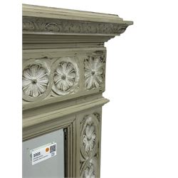 Victorian green and white painted mirror, rectangular bevelled plate within a moulded frame carved in relief with a continuous band of flowerhead roundels, the upper section with stepped cornice and leaf carved frieze  