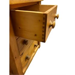 Large pine desk, rectangular top over four drawers, slide and panelled cupboard