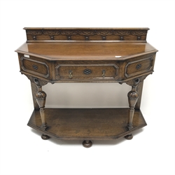 Early 20th century oak side table raised back, shaped front, single drawer, turned supports joined by single undertier, W107cm, H88cm, D48cm