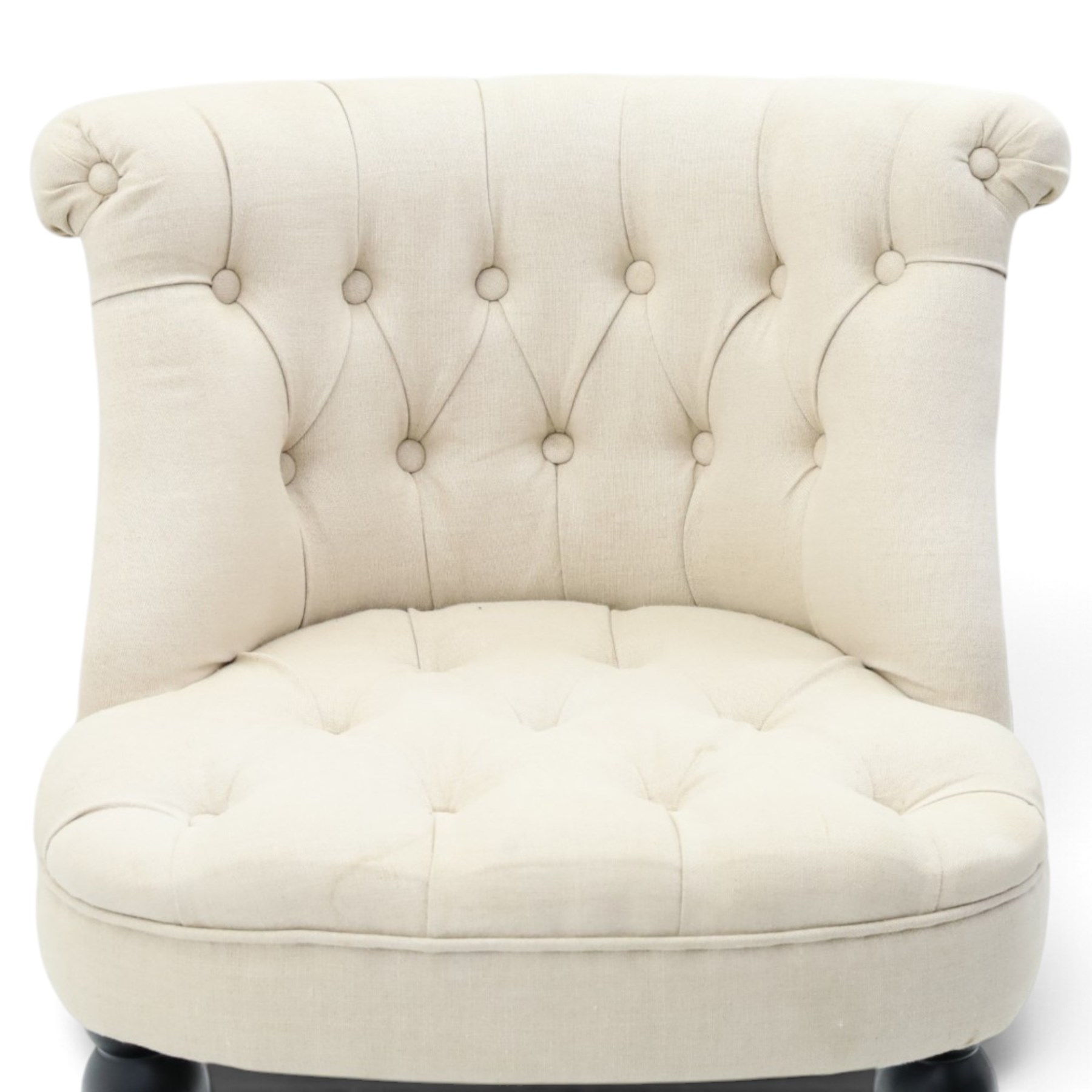 Victorian style upholstered tub chair, buttoned cream fabric back and seat with rolled sides, on ebonised turned front supports with brass castors and splayed rear supports