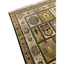 Persian design carpet, the field with various size tiles decorated with stylised plant motifs, floral urns and peacocks, the main border decorated with repeating foliate motifs and trailing flower heads