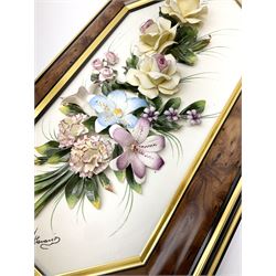 Set of three Capodimonte wall plaques, depicting floral decoration in octagonal frames with gilt edging, largest plaque H48, two small plaques H31cm.    