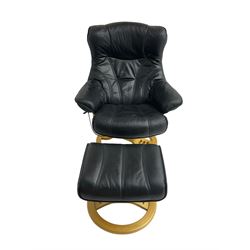 Anderssons of Sweden - mid-20th century design swivel armchair, upholstered black leather, raised on beech U-frame supports with circular base, together with matching footstool 