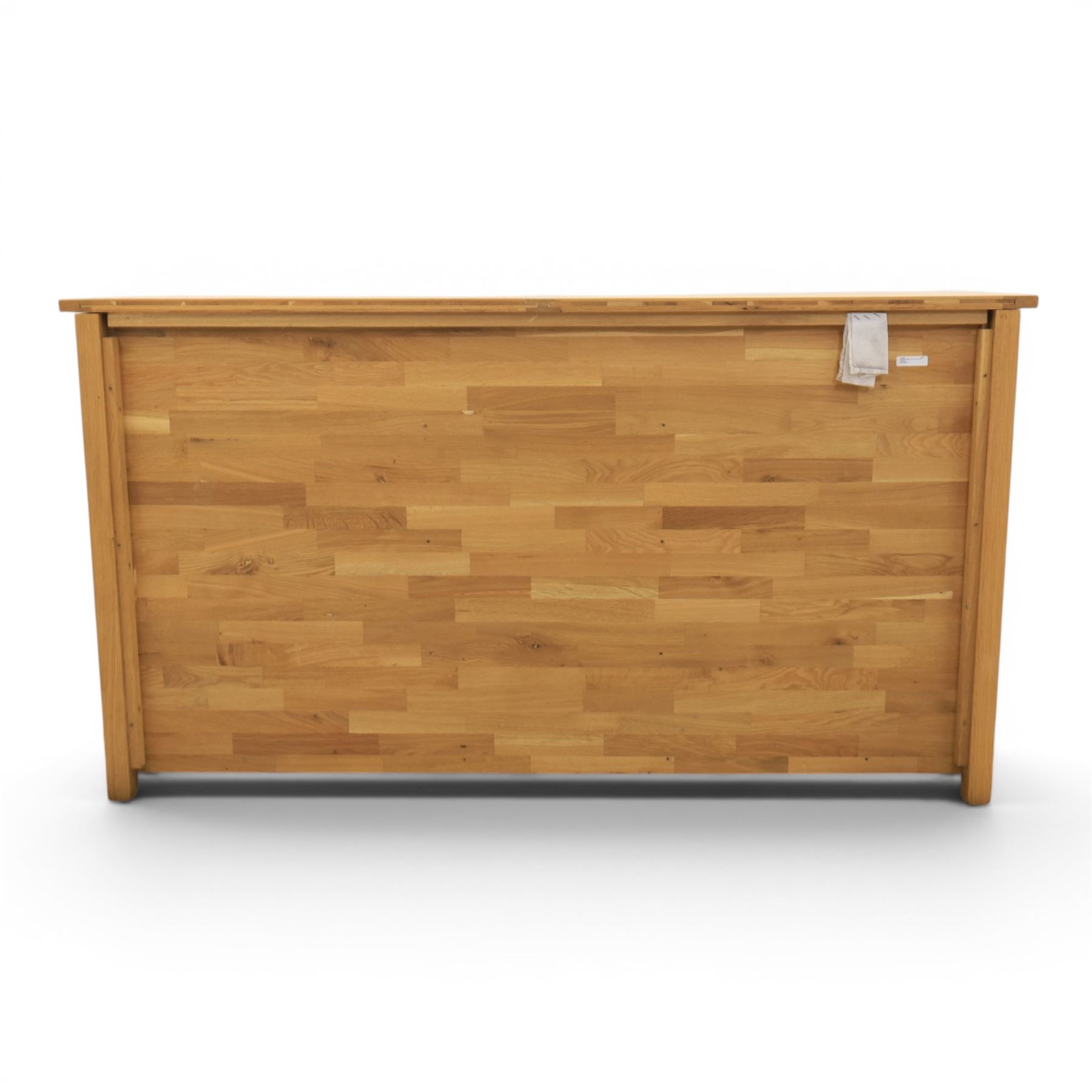 Solid oak sideboard fitted with drawers and cupboards, central bank of six drawers, metal pulls 