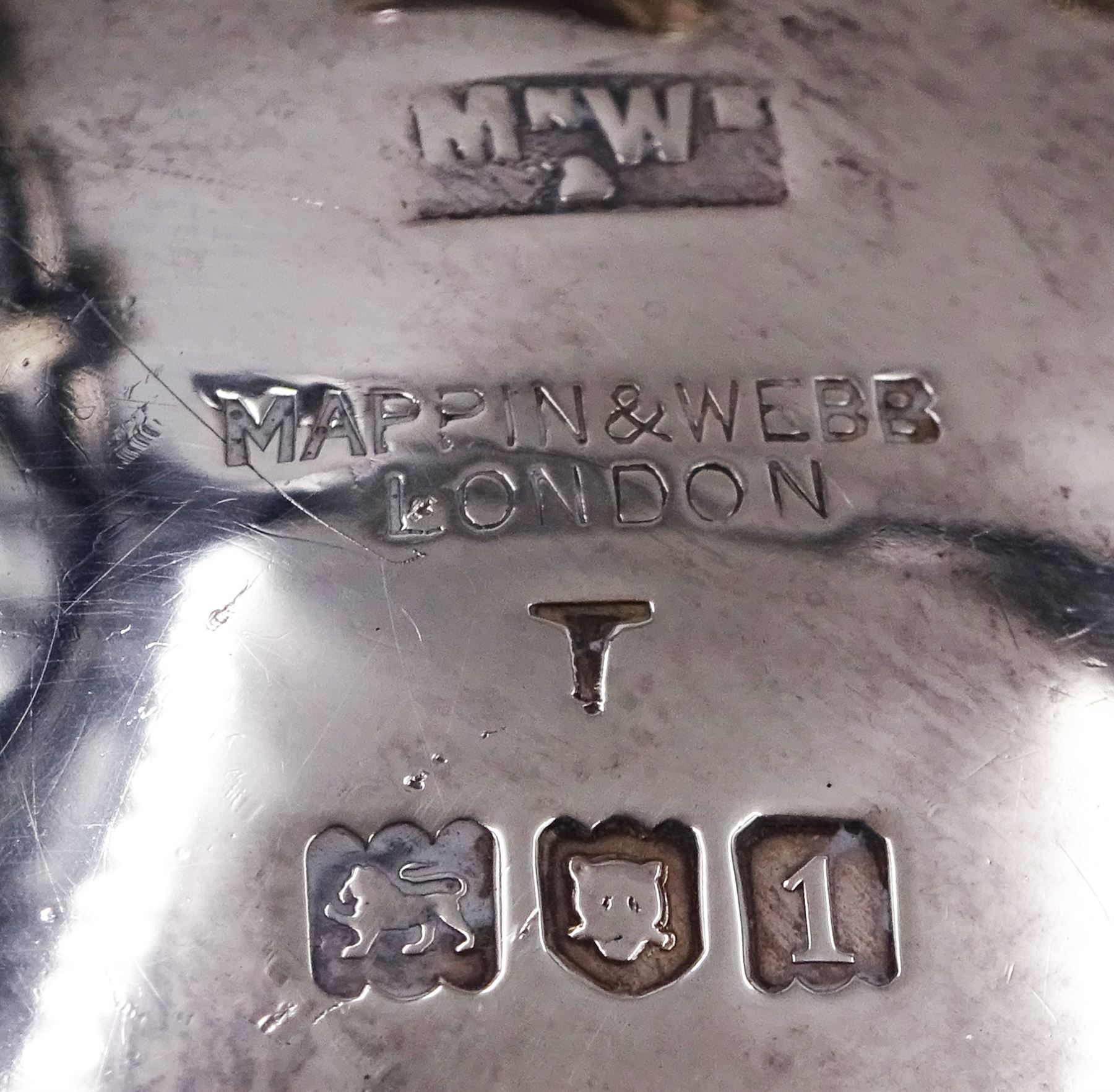 Group of silver, to include Edwardian silver open salt, of circular bellied form, with gadrooned rim, upon three shell feet, hallmarked Mappin & Webb Ltd, London 1906, together with a blank decanter label, repousse decorated with fruiting vines, hallmarked W I Broadway & Co, Birmingham 1995 and five silver pepper shakers, all hallmarked with various dates and makers, etc 