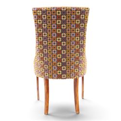 Barker & Stonehouse - cherrywood oval extending dining table and four upholstered chairs, the table with additional leaf extended to cm, raised on a turned column above swept supports, the chairs with brown upholstery and multi-coloured geometric design