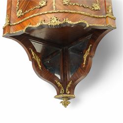 Pair of late 19th to early 20th century Kingwood and ormolu mounted encoignure or wall hanging corner cabinets, shaped end supports with mirror backs, serpentine double cupboard mounted by sevres design porcelain panels, decorated with foliate cast metal mounts, the interior fitted with shelf