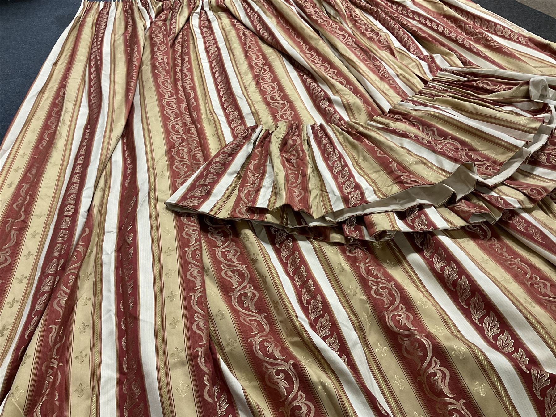 Montgomery interior fabrics - Pair pleated and lined curtains in red and gold regency striped fabric decorated with trailing foliage and matching pelmet (W445cm), each curtain - W233cm (at pelmet), Drop - 271cm