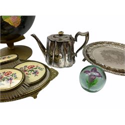 ladies vanity set with floral embroidery backs, comprising mirror, two brushes, comb and tray, along with paperweight with internal floral design, brass and copper bedwarmer, two metal serving trays, a metal teapot and a globe. 