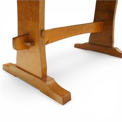 Beaverman - oak adzed top refectory table, the rectangular top raised on twin trestle supports with shaped feet united by a stretcher, the joints secured with exposed pegs, with carved beaver signature, by Colin Almack of Sutton near Thirsk