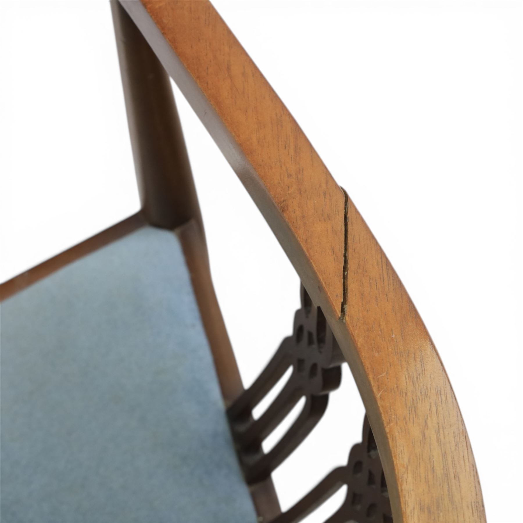 Early 20th century Hepplewhite style mahogany armchair, upholstered shaped back over pierced splat back with linked oval decoration, open arms and upholstered seat, on square tapering supports terminating in pad feet