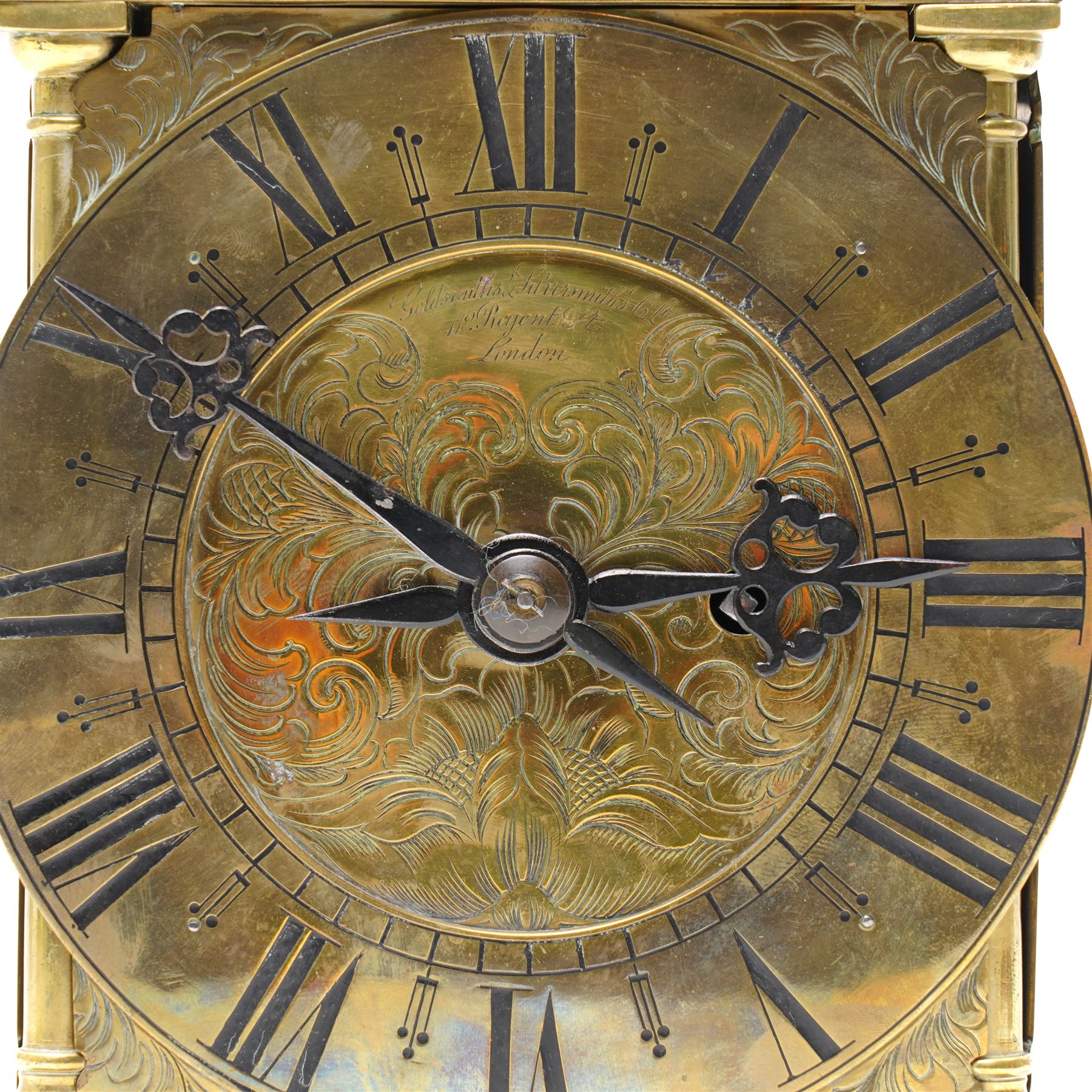 English-17th-century style replica 8-day lantern clock with a suspended bell and turned finials, with three ornate frets to the front and sides and opening side and rear doors, with an engraved dial centre and formerly silvered chapter with engraved Roman numerals, inner quarter hour track and period steel hands, dial engraved 