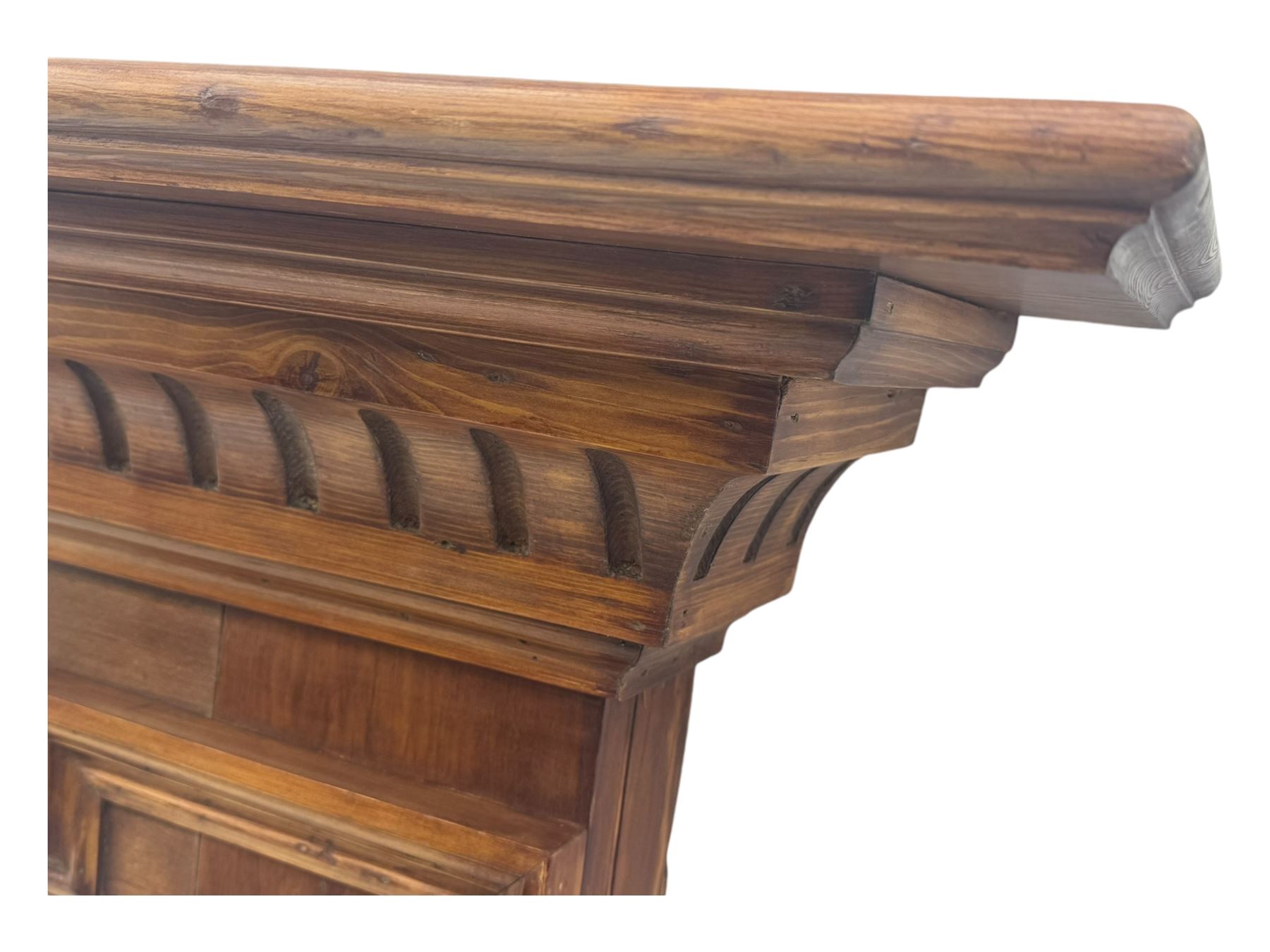 Victorian stained pine fire surround, projecting cornice with dentil moulding, panelled frieze and chamfered uprights on block supports