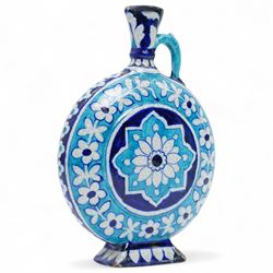 Indian 19th century Sind pottery moon flask, painted in colours of turquoise and cobalt blue, each side with lotus motif inside a border of flowers, H22.5cm