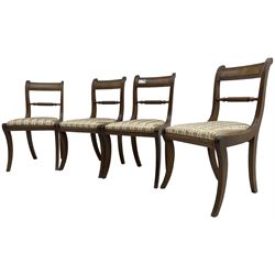Set of four Regency period mahogany dining chairs, rope-twist centre back bar over pink and ivory floral patterned drop-in seats, on reed moulded sabre supports