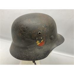 WW2 German Luftwaffe M40 double decal steel helmet with liner and chin strap; impressed NS62 to side skirt and D236 to back skirt