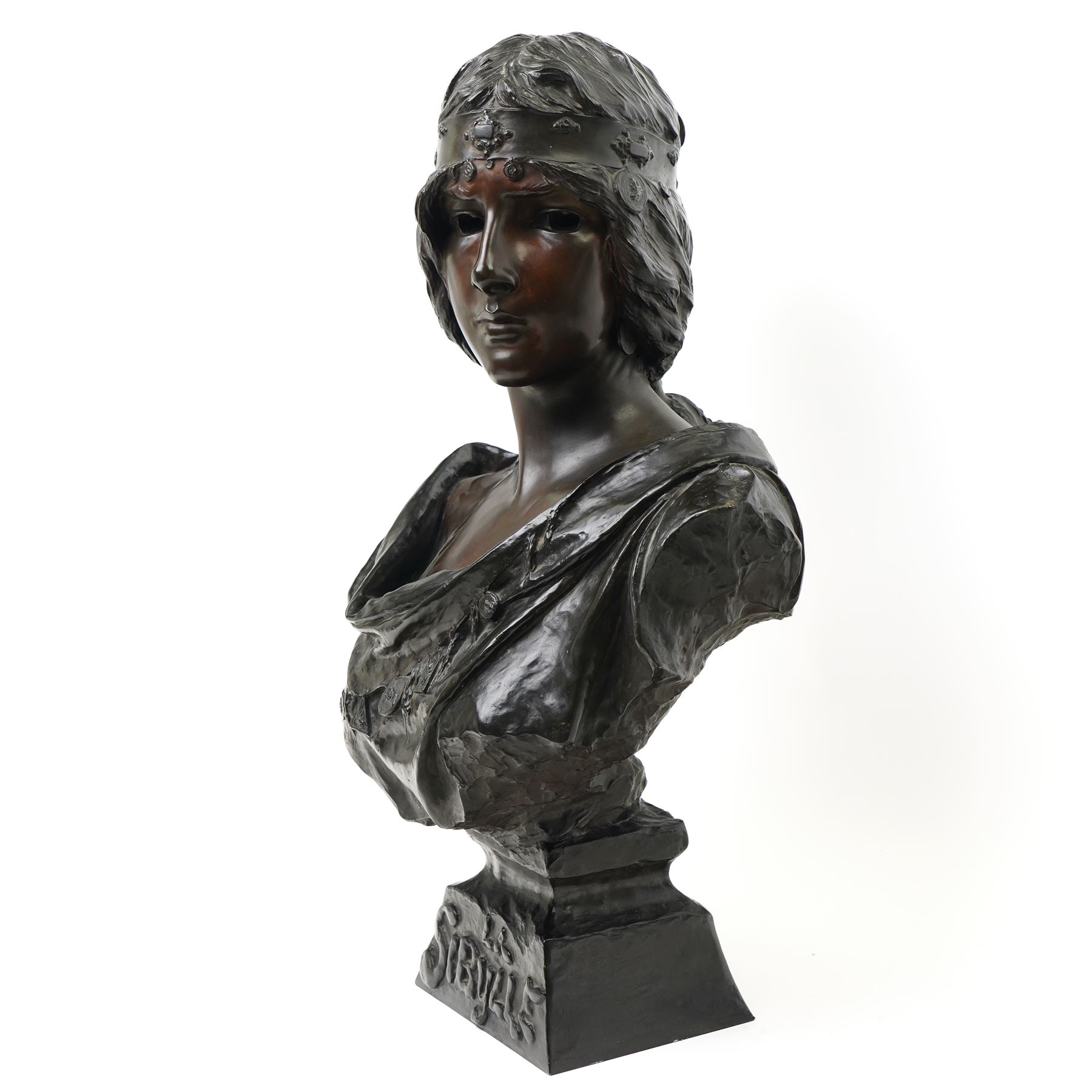 Emmanuele Villanis (French 1858-1914): Large Art Nouveau bronze bust 'La Sibylle' circa 1900, titled on the integral socle base and signed 'E.Villanis' in cast with 'Societe Des Bronzes De Paris' inset foundry mark and 'J.P 2888', H72cm
Notes: La Sibylle evokes the prophetic priestesses of classical antiquity, recalling the Cumaean Sibyl consulted by Aeneas in Virgil’s Aeneid