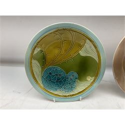 Set of three early 20th century Mintons Seccessionist plates by Leon Solon and John Wadsworth, decorated with stylised Art Nouveau tubelined patterns, comprising a pair decorated in the 'Hydrangea' pattern no. E3279, circa 1902, one with date code for 1906, together with further example moulded with a typical stylised motif tones of pink, brown and ochre with date code for 1903 all with impressed Minton and date code marks beneath, D22.5cm
