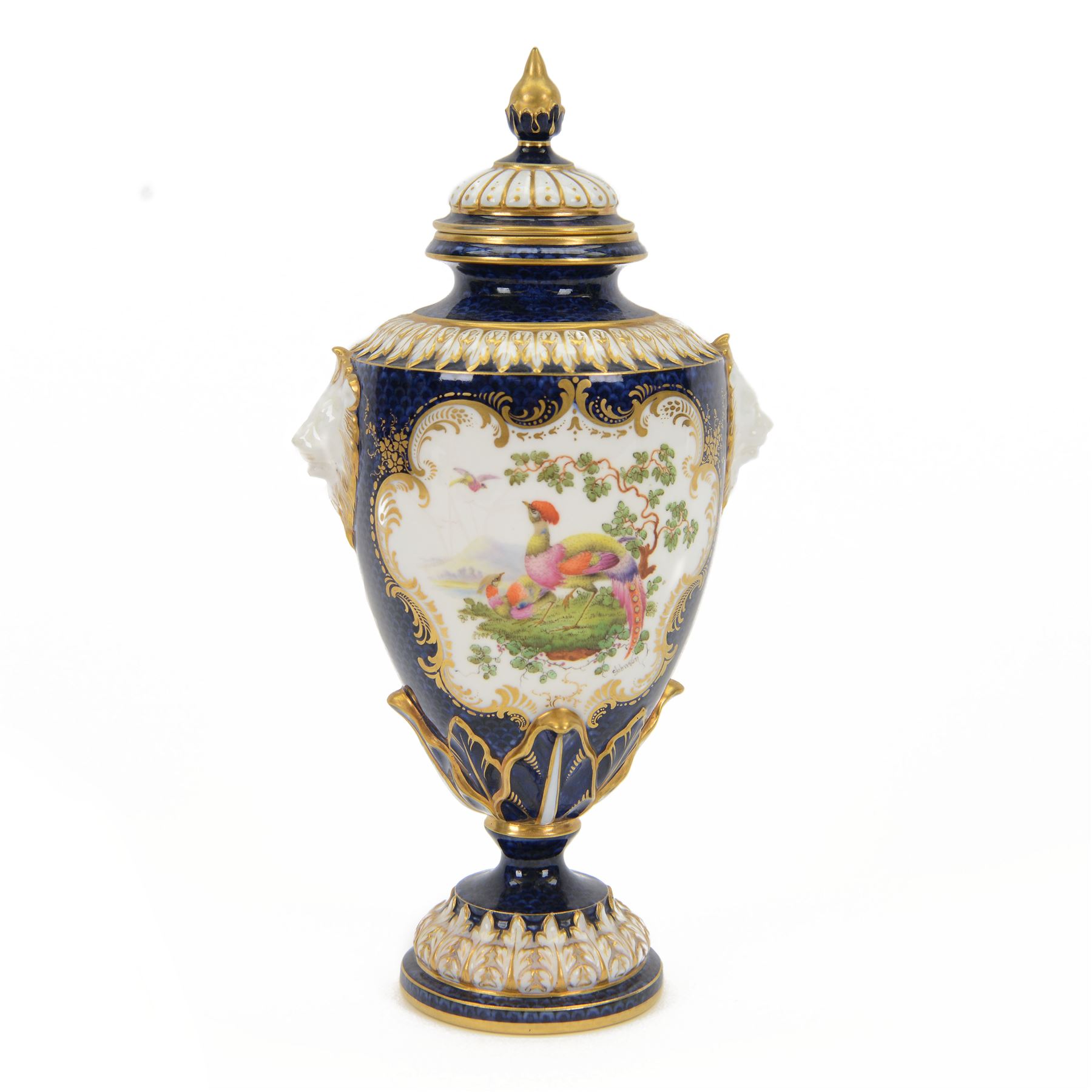 Late 19th century Royal Worcester porcelain vase and cover, circa 1897, of baluster form with twin lion masks to shoulders, painted with a reserve of exotic birds within a landscape, against a blue scale ground with gilt highlights, and further detailed with smaller reserves containing butterflies, the shoulder, base of body and foot with moulded acanthus bands, upon a circular spreading foot, with green printed marks beneath including shape number 2305 and Rd no 419210, H27.5cm