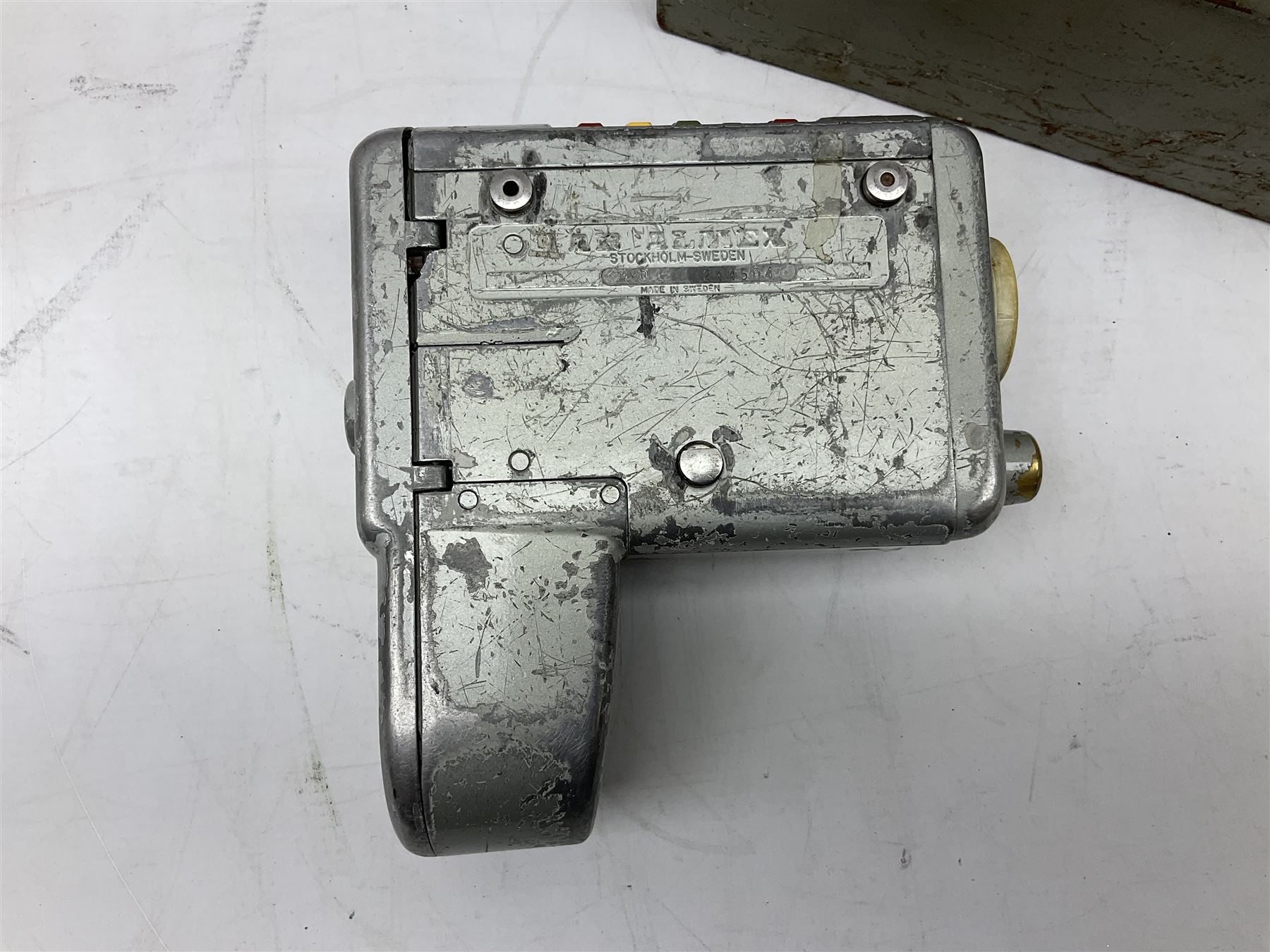 Bell Punch Company of London 'The Ultimate' five lever fare collection machine, together with an Almex ticket machine with shoulder strap, two brass Halifax transport cap badges, other chrome tramway cap badges, etc