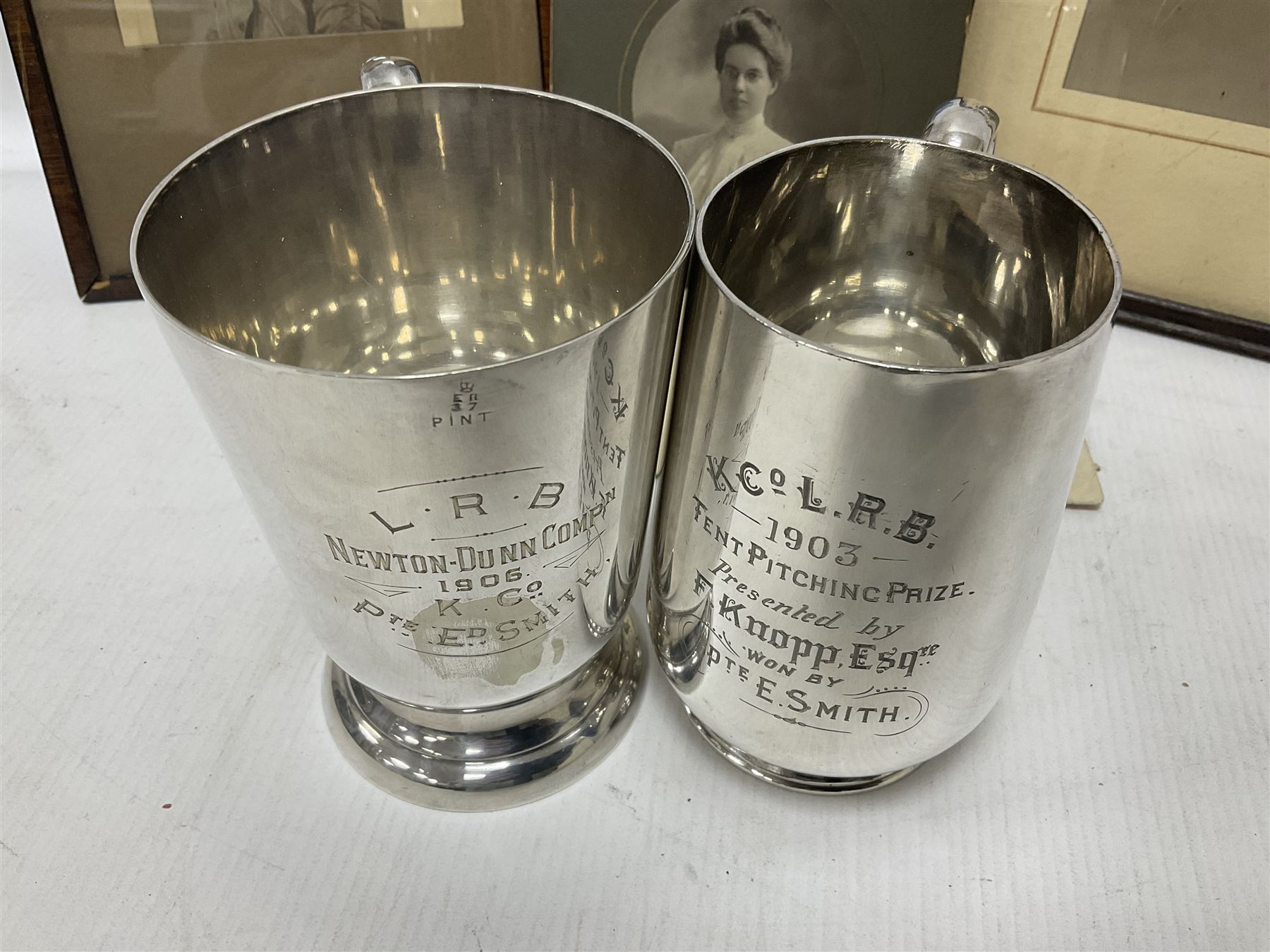 WWI bronze death plaque to Edwin Smith, together with two tankards presented to E.Smith and photographs of his family  