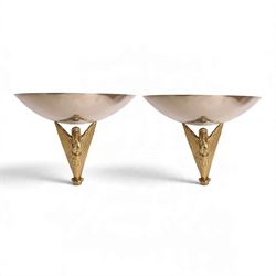 Pair of Art Deco gilt-brass wall lights, circa 1930, each modelled as a stylised female fi...