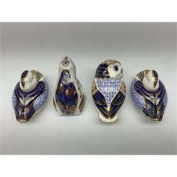 Three Royal Crown Derby paperweights, two examples modelled as ducks, one with gold stopper, the other with silver, an owl lacking stopper, and an Imari patterned frog lacking stopper. (4). 