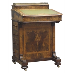  19th Century inlaid figured walnut Davenport, with brass galleried stationery compartment and leather inset slope top above four real & four faux drawers with turned wooden handles, bun turned feet with brass sockets and castors, H86cm, W56cm, D55cm  